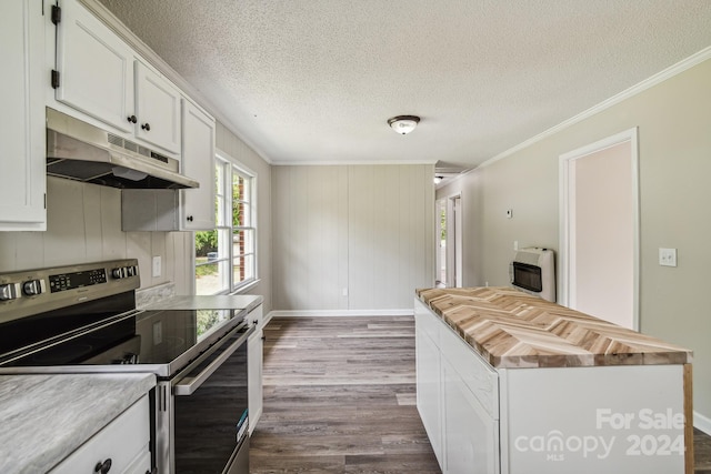 kitchen featuring heating unit, electric range, white cabinets, and hardwood / wood-style flooring