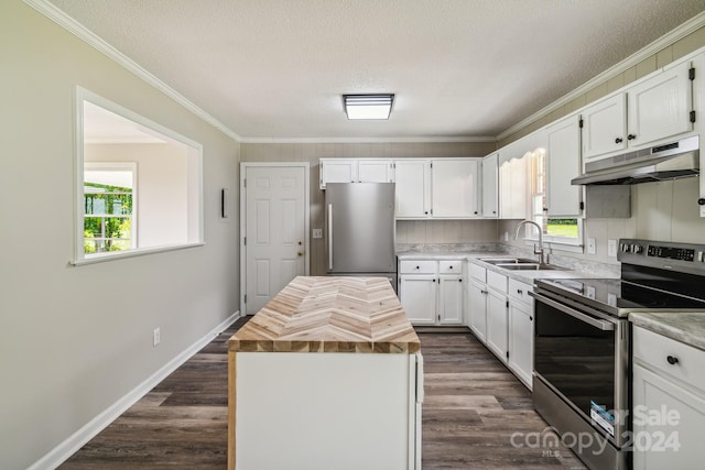 kitchen featuring a kitchen island, sink, white cabinets, and appliances with stainless steel finishes