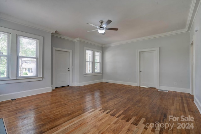 interior space featuring ceiling fan, a wealth of natural light, hardwood / wood-style flooring, and crown molding