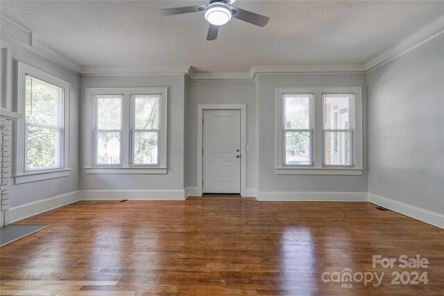 foyer featuring ceiling fan, wood-type flooring, and ornamental molding