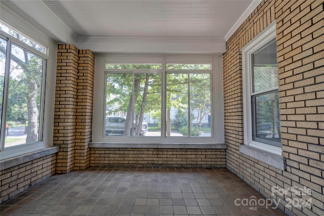 unfurnished sunroom with a wealth of natural light