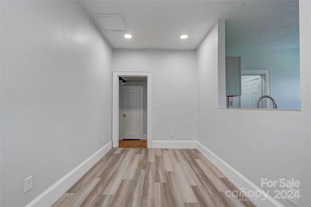 spare room with light hardwood / wood-style flooring