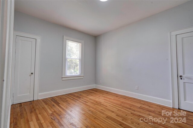 unfurnished room featuring light hardwood / wood-style flooring