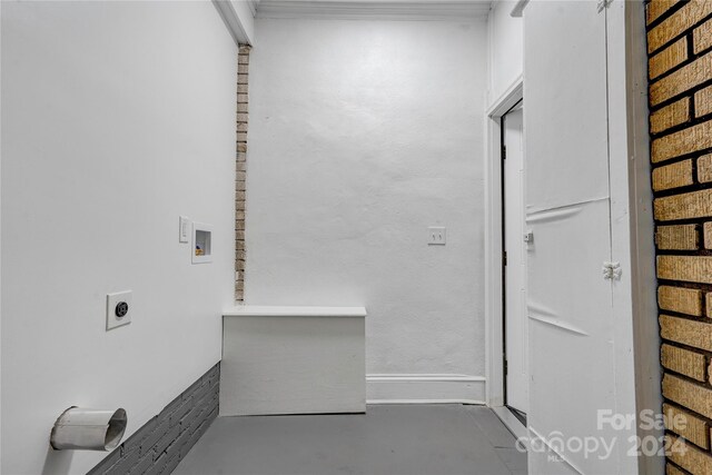 clothes washing area featuring hookup for an electric dryer and hookup for a washing machine