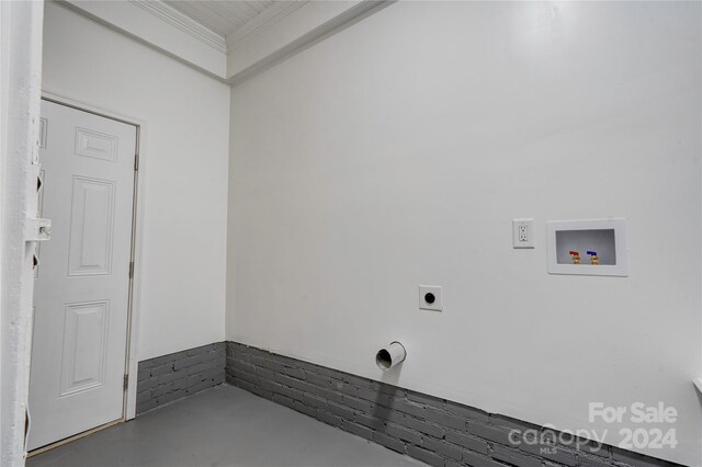 clothes washing area featuring electric dryer hookup, crown molding, and hookup for a washing machine