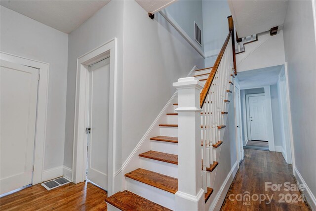 staircase featuring hardwood / wood-style flooring