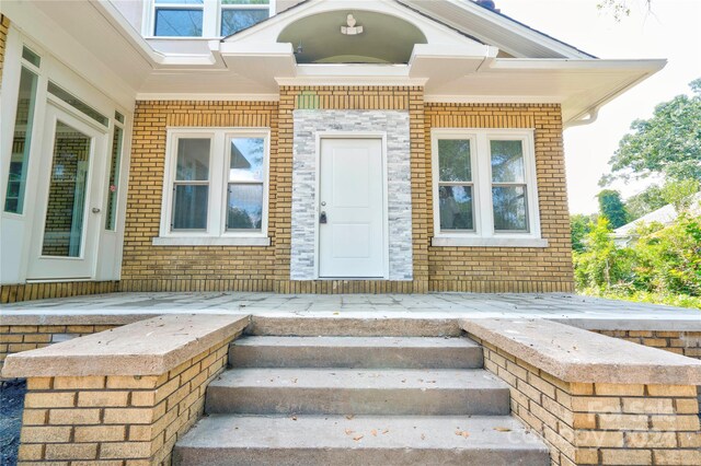 doorway to property featuring a patio area