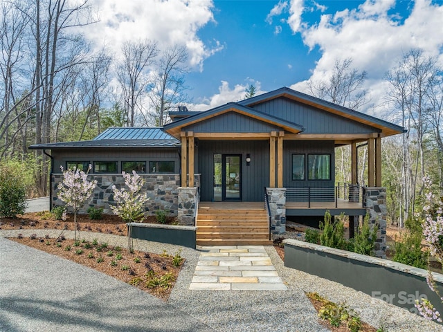 140 Upperfell Ct Unit 708, Asheville, NC 28803 - view of front of property with covered porch, stone siding, metal roof, and a chimney