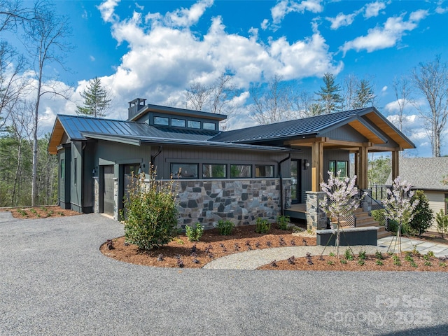 140 Upperfell Ct Unit 708, Asheville, NC 28803 - view of front of home featuring metal roof, board and batten siding, gravel driveway, and a porch