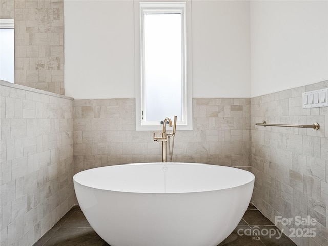 140 Upperfell Ct Unit 708, Asheville, NC 28803 - bathroom with tile walls, tile patterned floors, and a freestanding bath