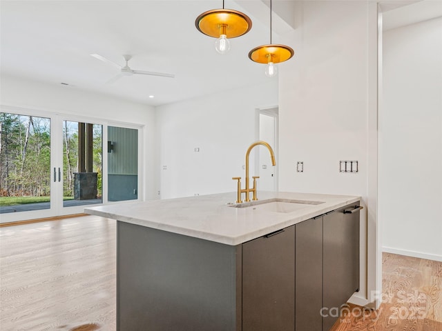 140 Upperfell Ct Unit 708, Asheville, NC 28803 - kitchen featuring open floor plan, light wood-type flooring, hanging light fixtures, a sink, and a ceiling fan