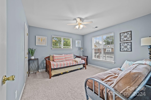 carpeted bedroom with ceiling fan