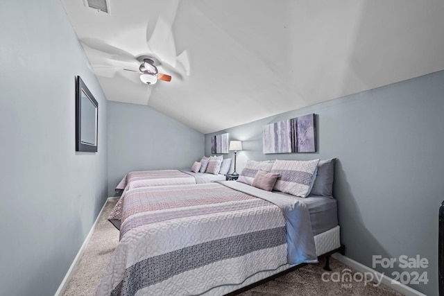 bedroom with ceiling fan, carpet floors, and lofted ceiling