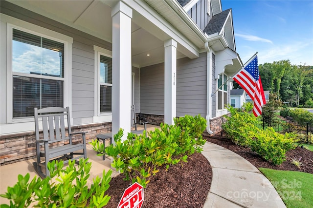 doorway to property with covered porch