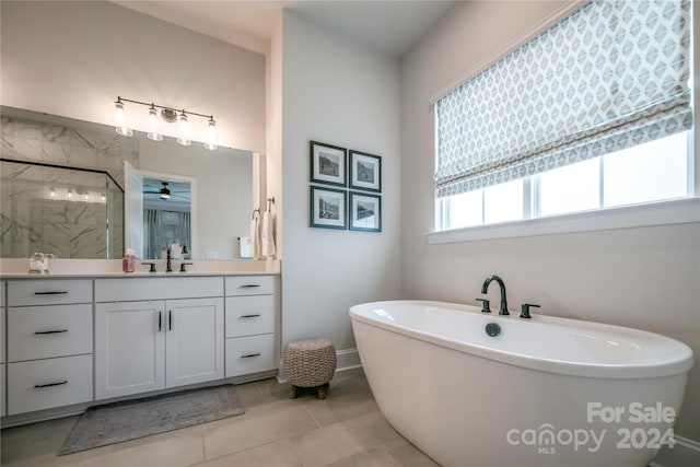 bathroom featuring independent shower and bath, ceiling fan, vanity, and tile patterned floors