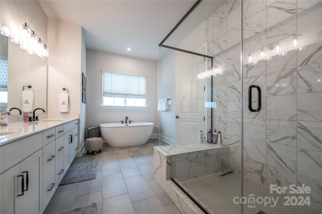 bathroom featuring vanity, tile patterned floors, and separate shower and tub