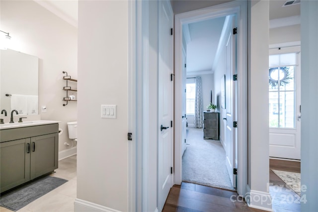 bathroom featuring hardwood / wood-style floors, vanity, and toilet