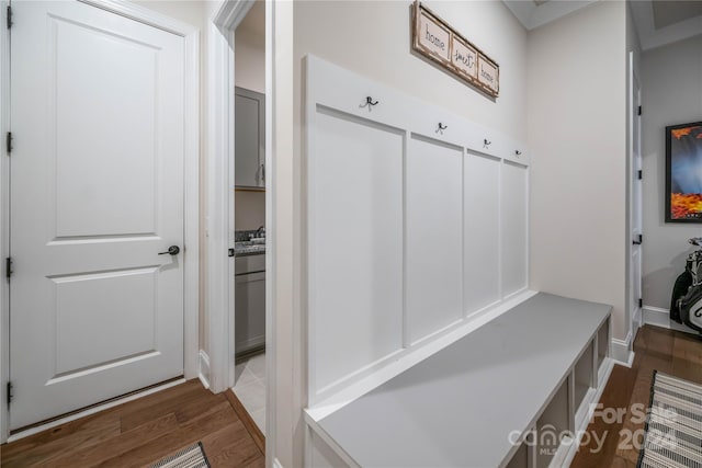 mudroom with light hardwood / wood-style floors