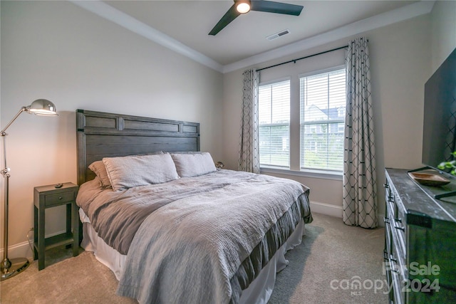 bedroom with light carpet and ceiling fan