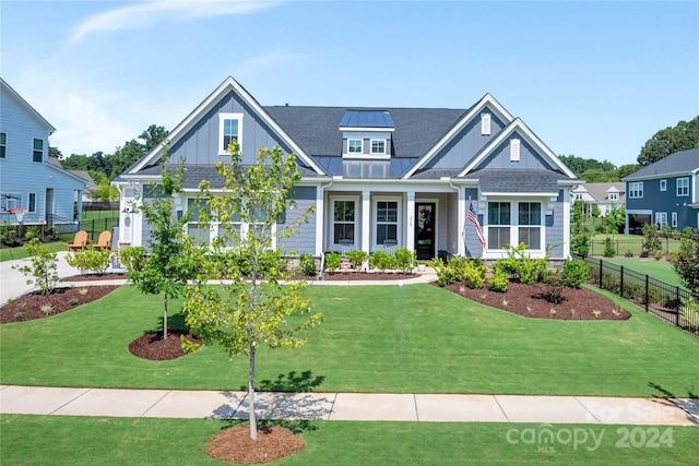 craftsman house with a front lawn