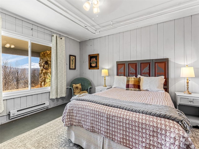 bedroom featuring ceiling fan, a baseboard heating unit, wood walls, and crown molding