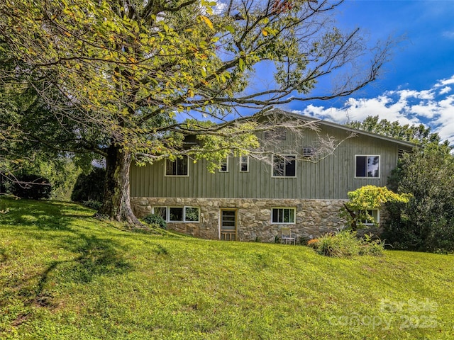 view of property exterior with a lawn