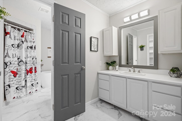 bathroom with crown molding, vanity, and tile patterned flooring