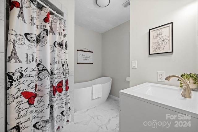 bathroom with tile patterned floors and vanity