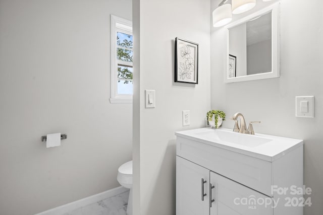 bathroom with tile patterned floors, vanity, and toilet