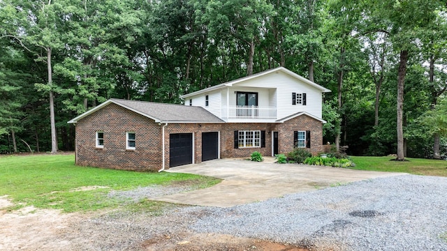 front of property with a garage and a front lawn