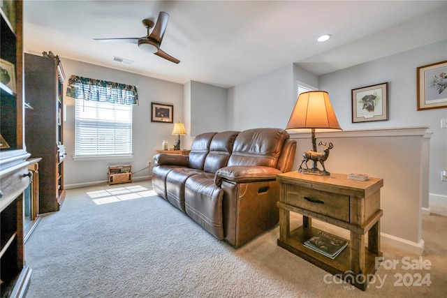 living room with ceiling fan and light carpet