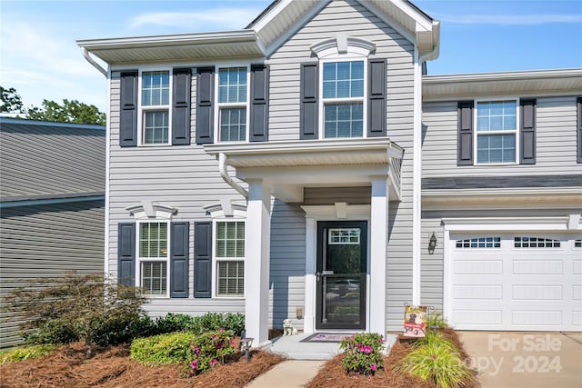 view of front of property with a garage