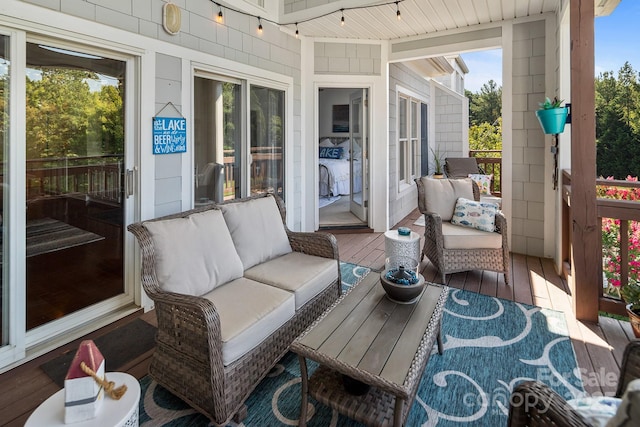 sunroom featuring a wealth of natural light and wooden ceiling