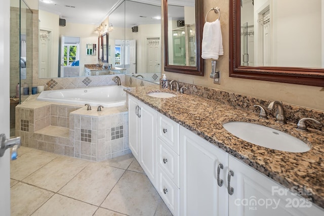 bathroom with shower with separate bathtub, vanity, and tile patterned floors