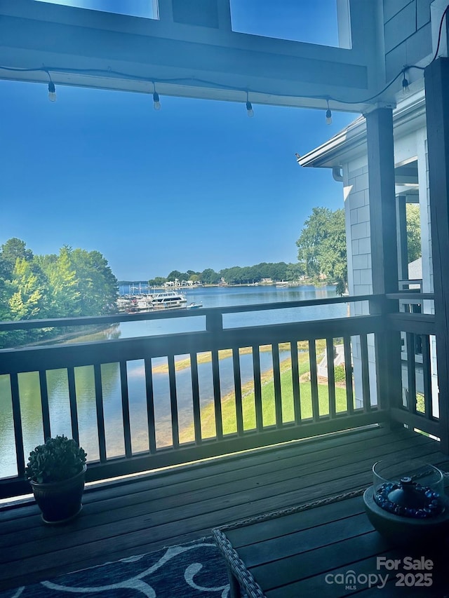 wooden deck with a water view