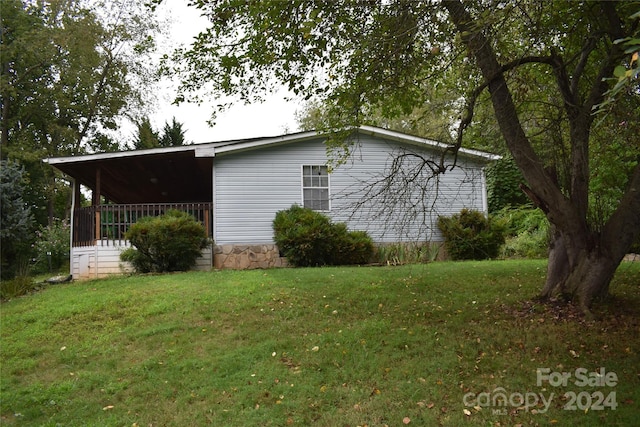 view of home's exterior featuring a yard