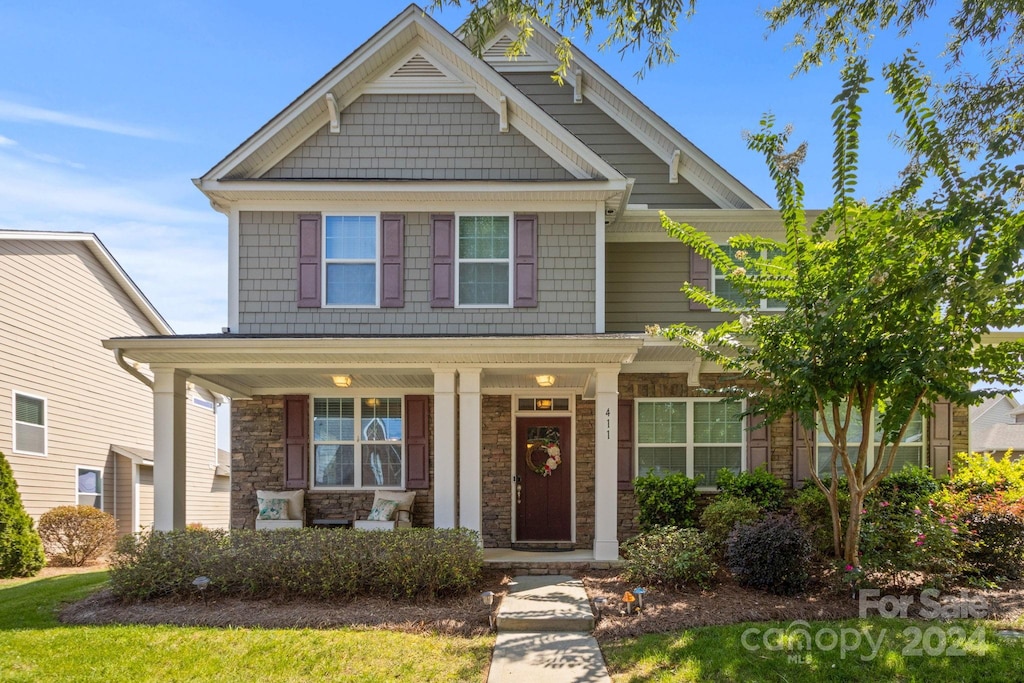 craftsman-style home with covered porch