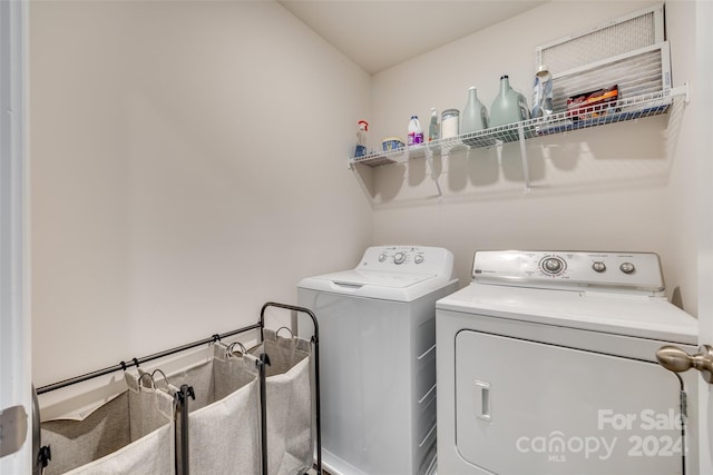 laundry area with separate washer and dryer