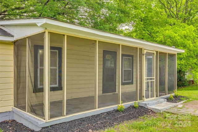 exterior space featuring a sunroom