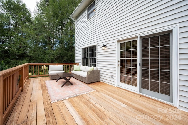 wooden deck featuring an outdoor hangout area