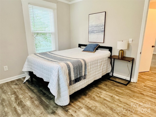 bedroom featuring hardwood / wood-style flooring