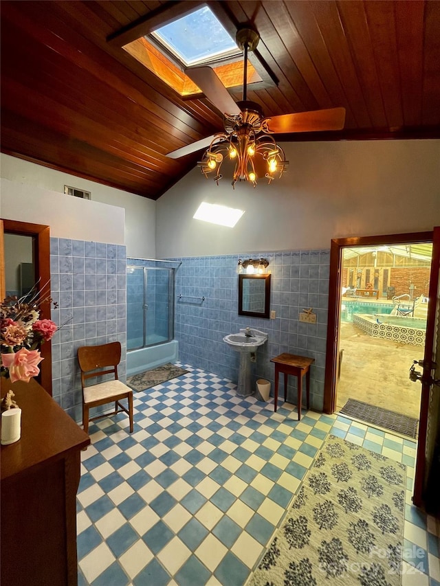 full bath featuring wooden ceiling, a wainscoted wall, visible vents, tile walls, and a stall shower