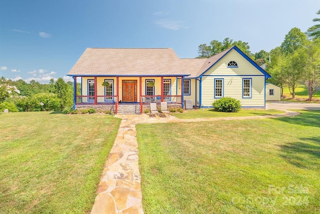 view of front of house with a porch, central AC unit, and a front yard