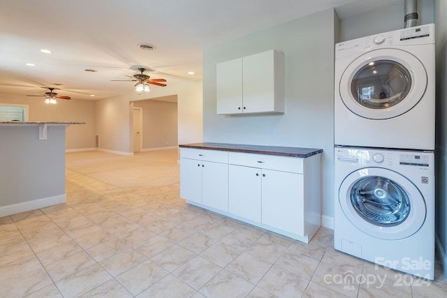 laundry area with ceiling fan and stacked washing maching and dryer