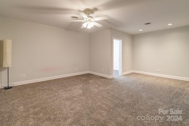 unfurnished room with ceiling fan and carpet floors