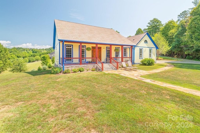 view of front of house featuring a front yard and a porch