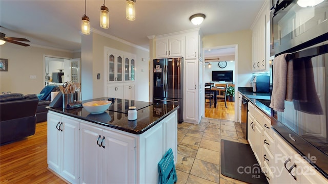 kitchen featuring black appliances, decorative light fixtures, white cabinetry, ornamental molding, and ceiling fan