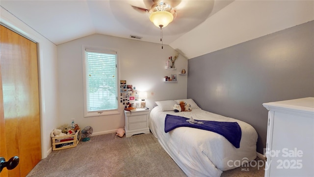 bedroom with ceiling fan, light colored carpet, and vaulted ceiling