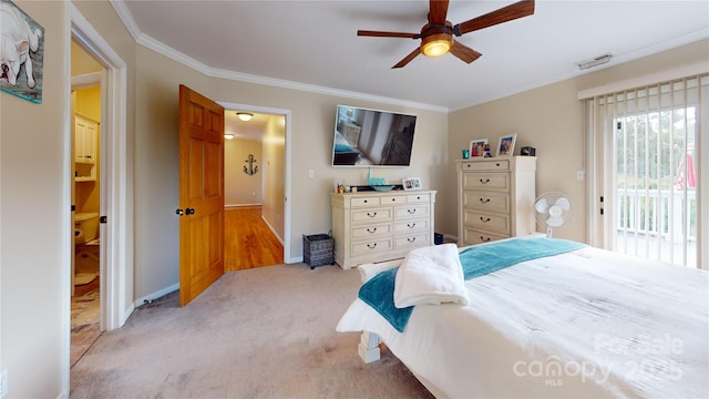 carpeted bedroom featuring ceiling fan, ornamental molding, and access to outside