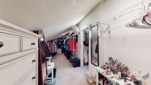 spacious closet featuring vaulted ceiling